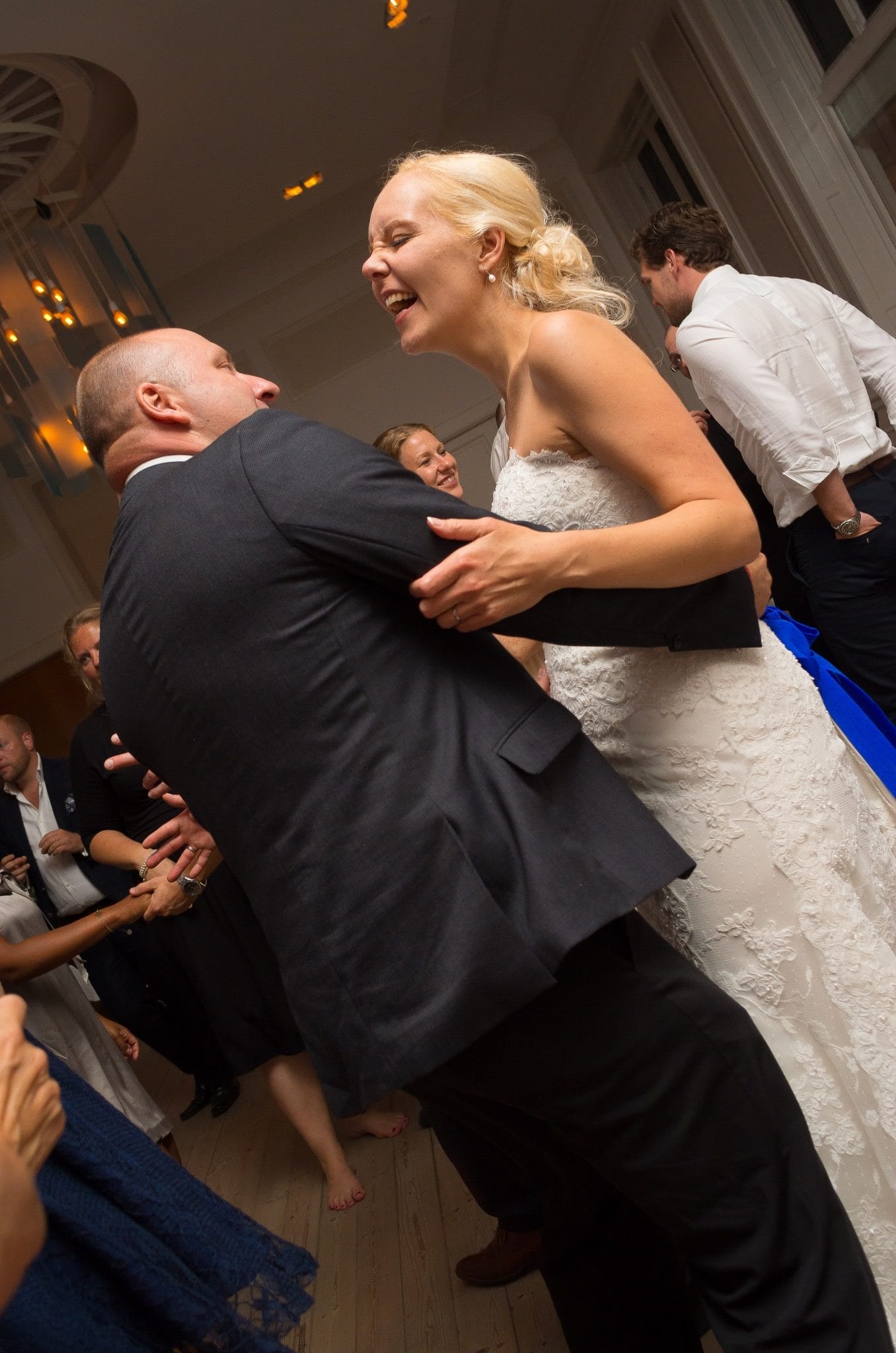 Bride laughing on the dance floor